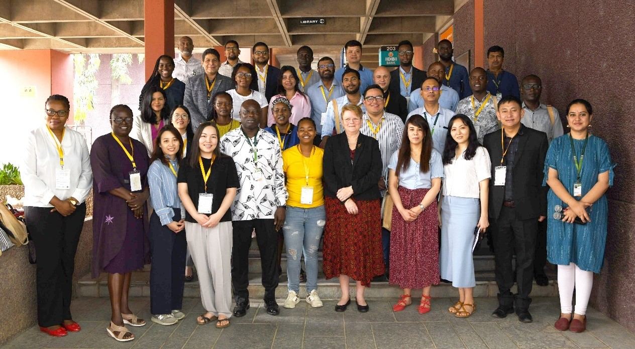 Participants take a group photo with the Director General of ICRISAT, Dr Jacqueline Hughes