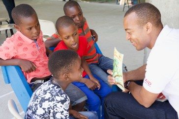 Rafer Gordon from the OECS EDMU reads to students as part of the USAID/OECS ELP 
