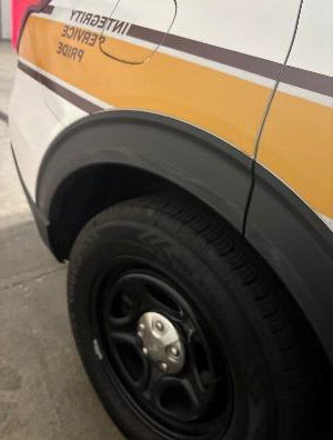 Driver's Side Mirror of Troop 9 Squad Car
