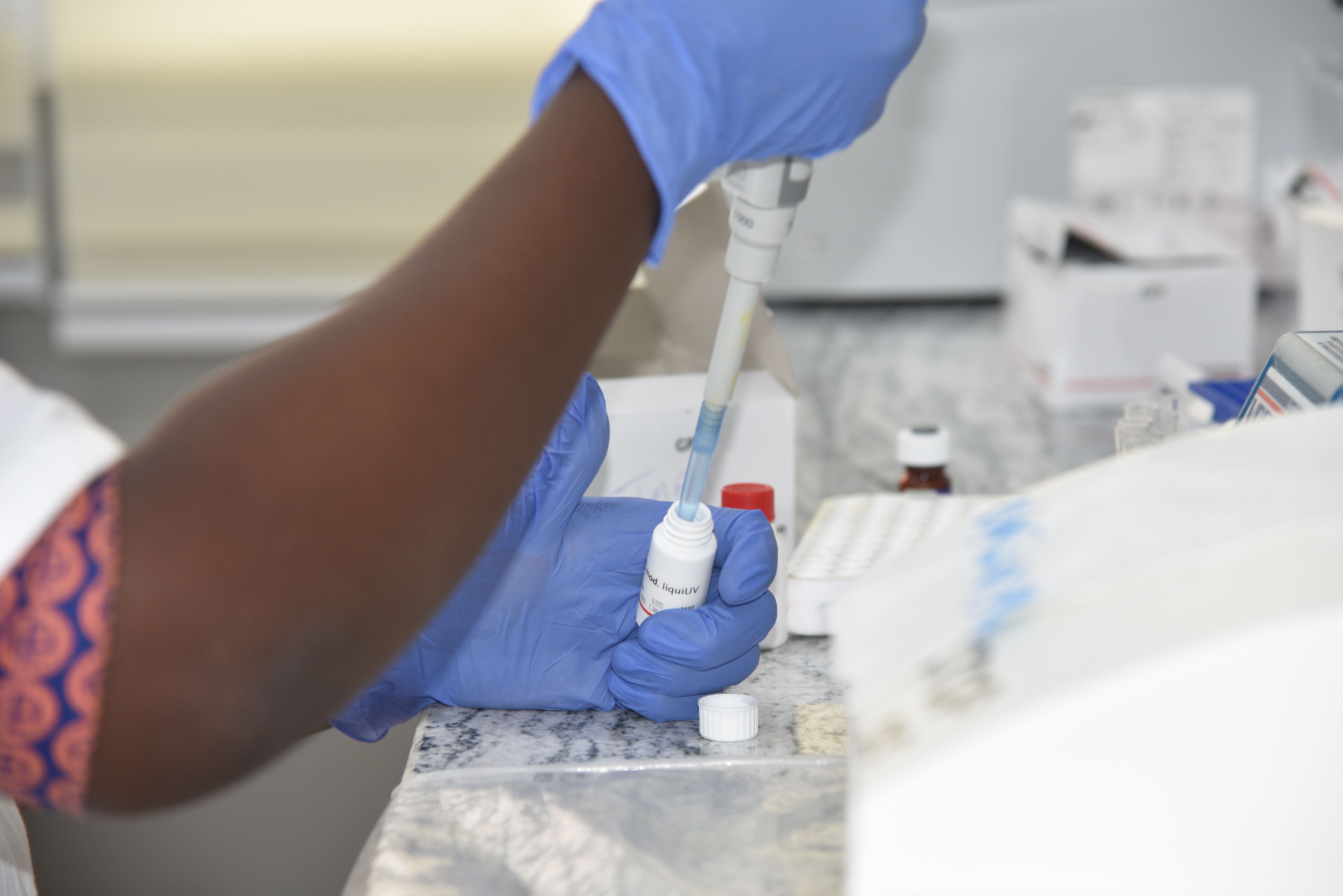 Title: TB testing - Copyright: MSF/Ammar Obeidat - Countries: Sierra Leone - Date taken / Date Recorded: 08 December, 2023 - Caption / Description: A laboratory staff conducting a biochemistry test inside the MSF-supported TB laboratory of Makeni regional hospital, Bombali district, Sierra Leone. Biochemistry testing is done to assess the liver of drug resistant Tb (DR TB) patients being treated at the hospital