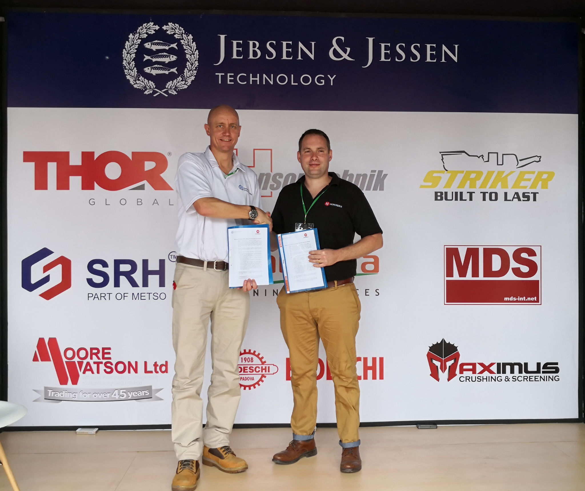Michael Nielsen, President Director of Jebsen & Jessen Technology Indonesia signs partnership with Matt Beverley, Managing Director of Hoverdale UK