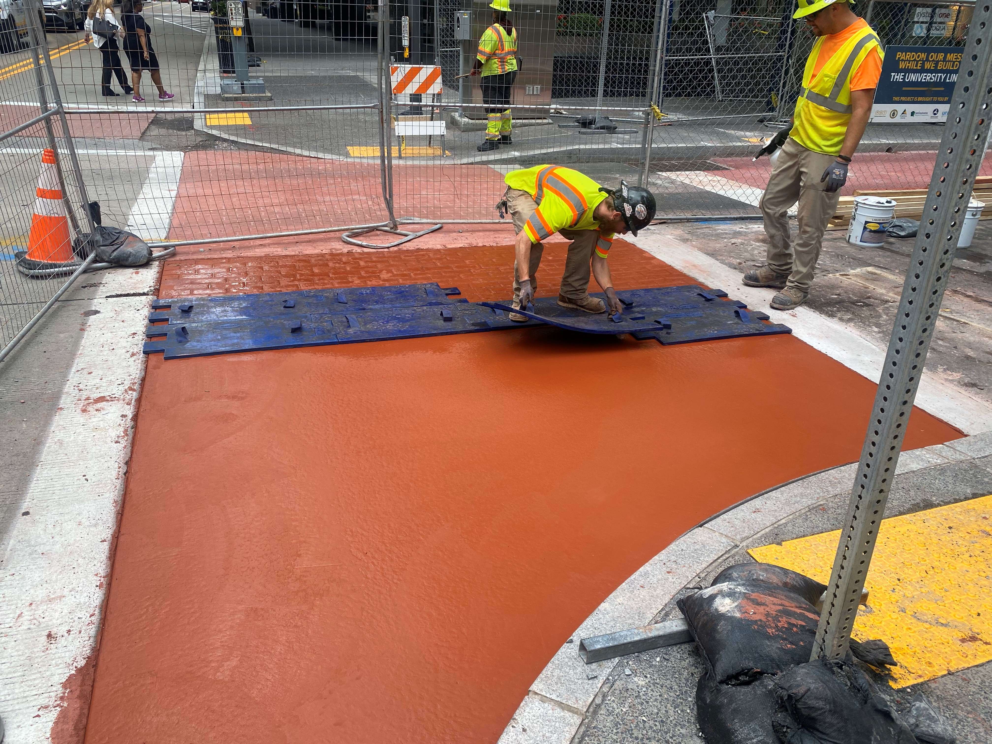 A stamped concrete crosswalk was recently placed at Sixth Avenue and Wood Street A stamped concrete crosswalk was recently placed at Sixth Avenue and Wood Street