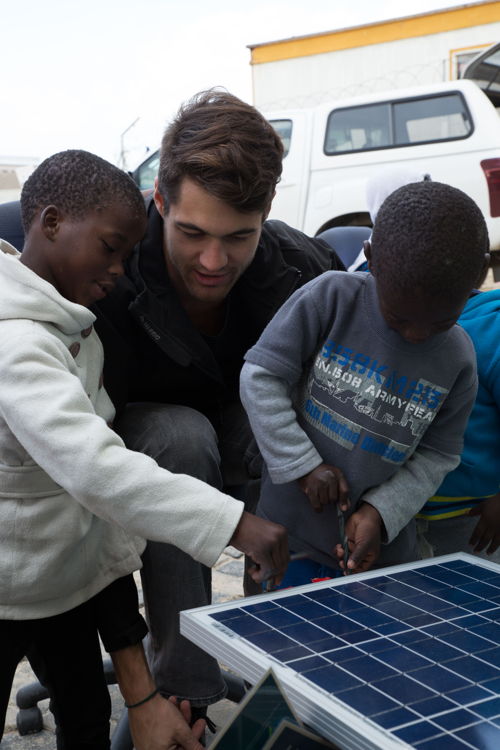 Solar engineer Stefano Semprini and the children from Abaphumeleli Home