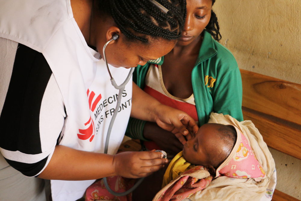An MSF health worker listens to a malnourished child’s chest at the stabilisation centre in Gedeb hospital, in Gedeo, south Ethiopia. Copyright: Markus Boening/MSF