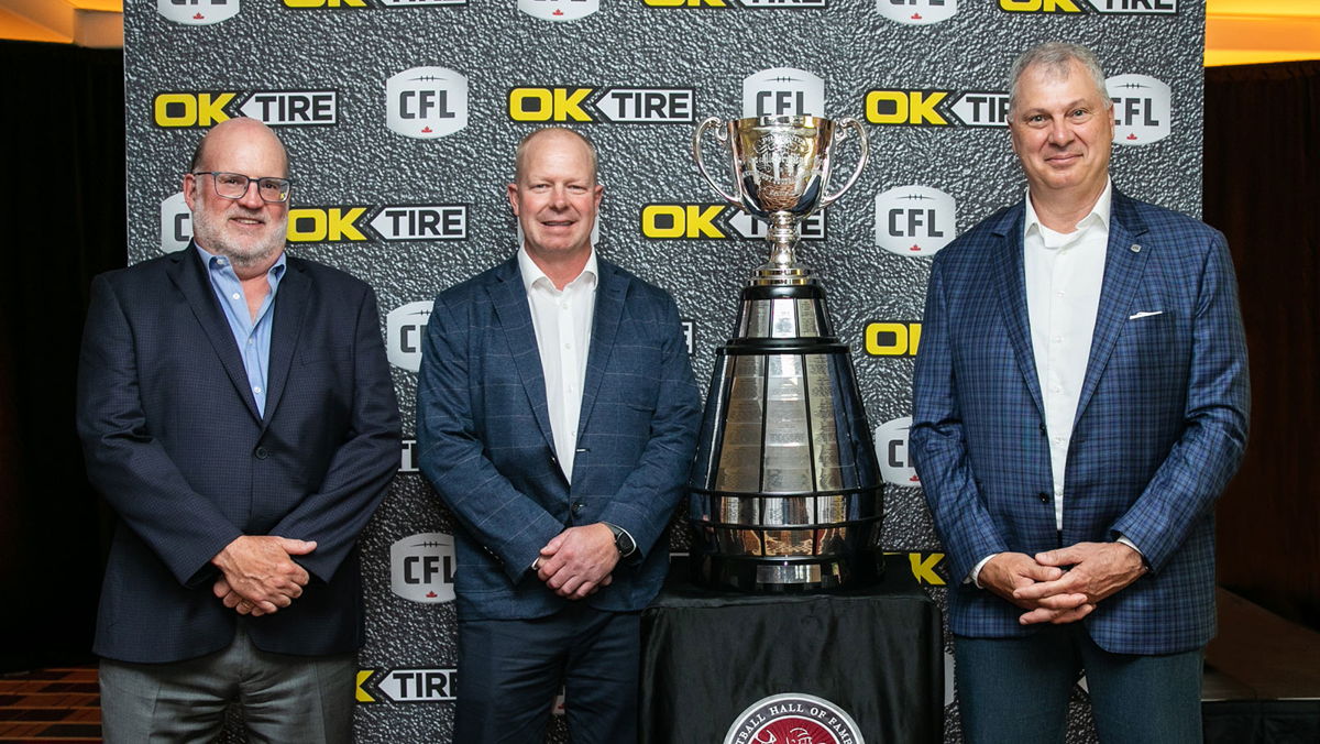 (Left to right) Jim Bethune, President and CEO – OK Tire, Shayne Casey, Chair, Board of Directors – OK Tire, Randy Ambrosie, Commissioner – CFL (Kelly Clark/CFL.ca)
