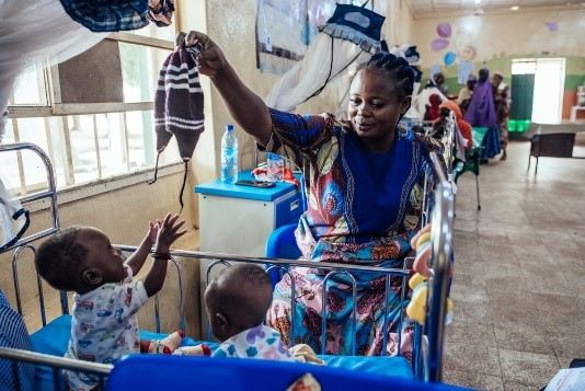 Amaka Joseph, 35, plays with her sons, John and Jerry, 11 months, who are recovering from malnutrition at an inpatient therapeutic feeding facility at Specialist Hospital Sokoto, Nigeria. Play doesn’t require special equipment – as Amaka’s woolly hat proves.
