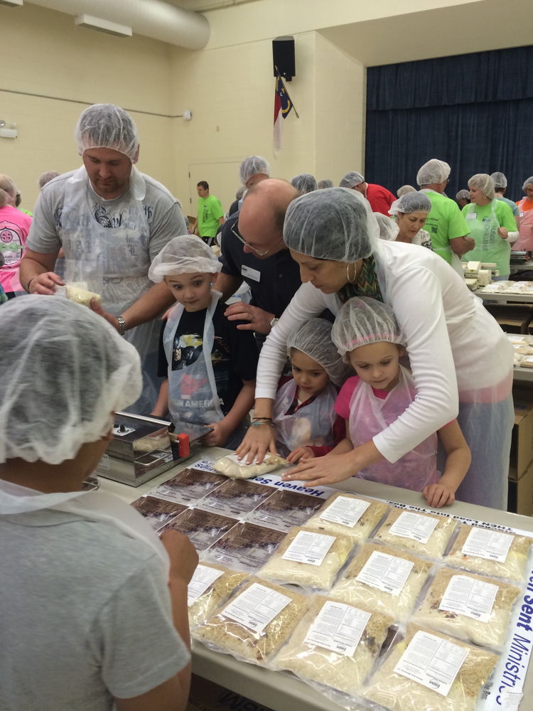 High school students provide much needed service and help younger students prepare food.