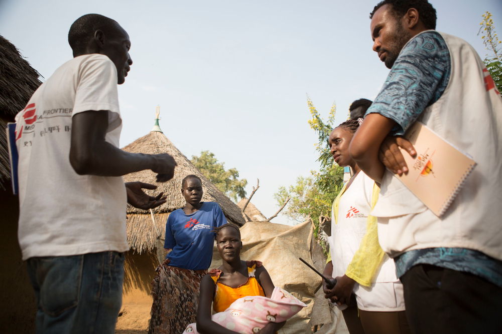 MSF health outreach staff attend to a woman who lives in Kule refugee camp and recently gave birth on 24 Nov 2017. The health outraeach workers attend to families in a specific neighborhoods inside the camp assuring they are keeping up with their children and own health. Photographer: ZACHARIAS ABUBEKER