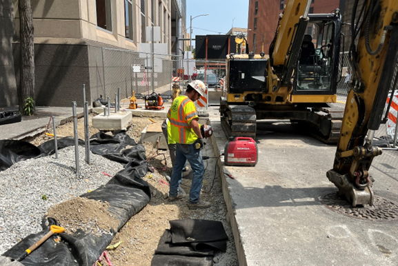 PRT’s contractor at Fifth Avenue and Ross Street preparing to place a concrete footer that will support the new granite curb