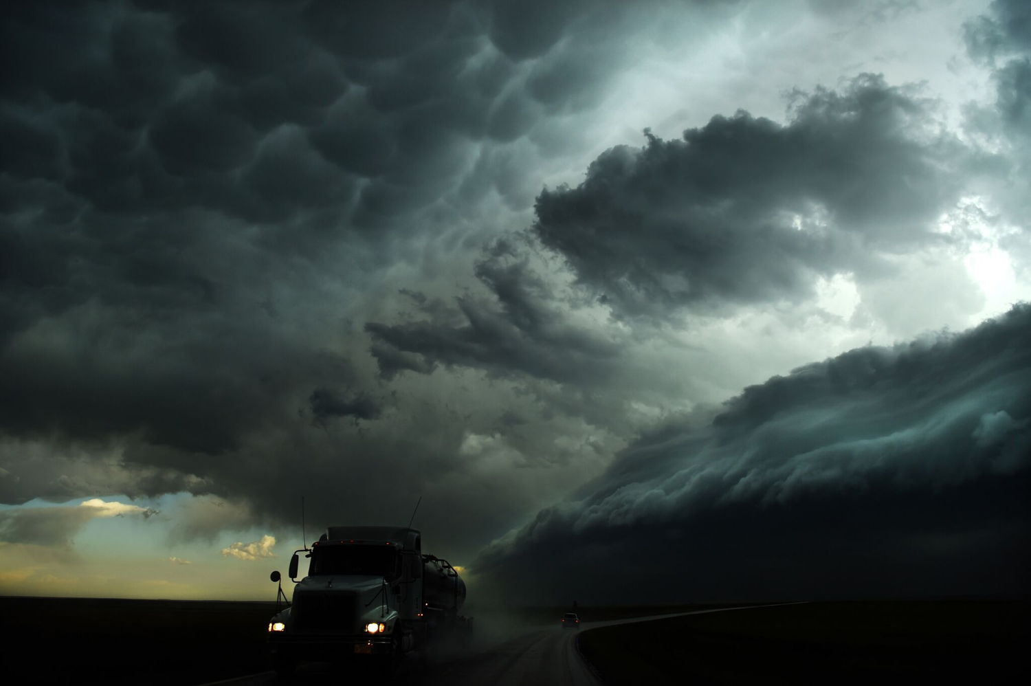 Nick Moir, Fairfax Media, “Gust Front 1 A truck drives away from the huge shelf cloud in western Kansas”