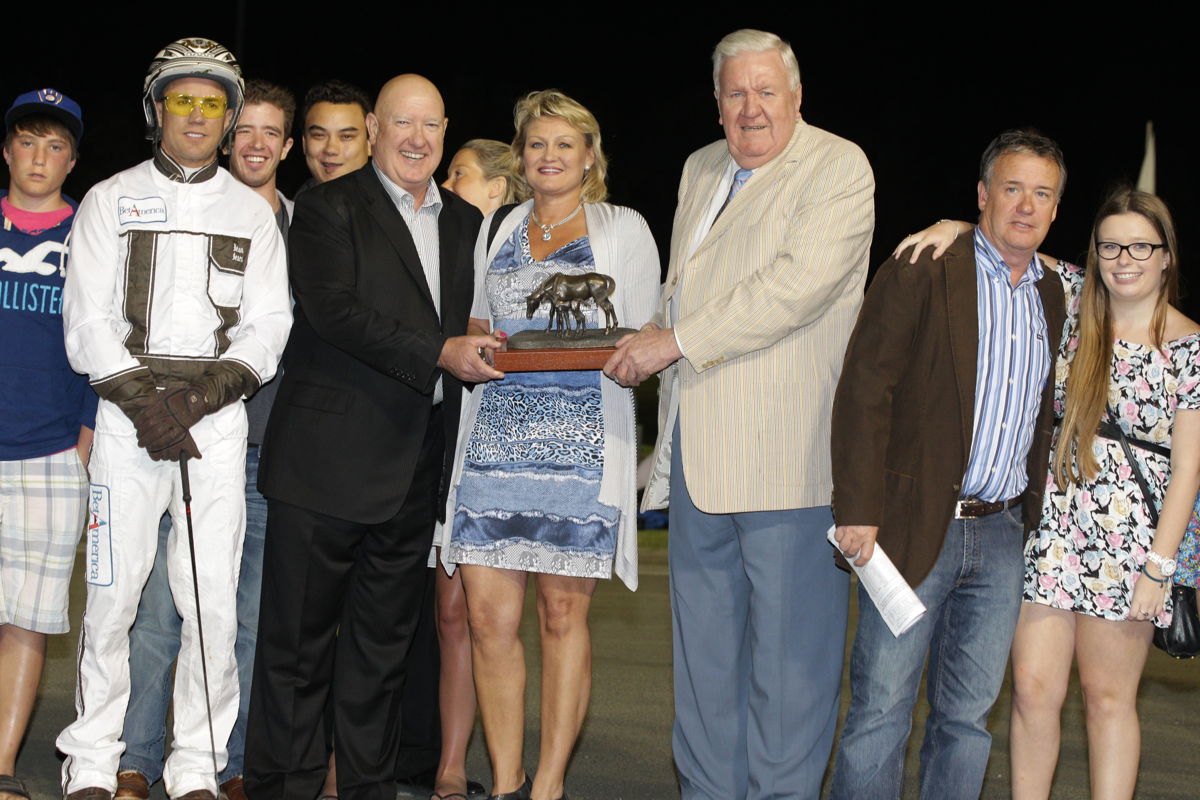 Dr. Glen Brown, third from right, presenting the Fan Hanover trophy to the connections of 2011 winner See You At Peelers. (New Image Media)