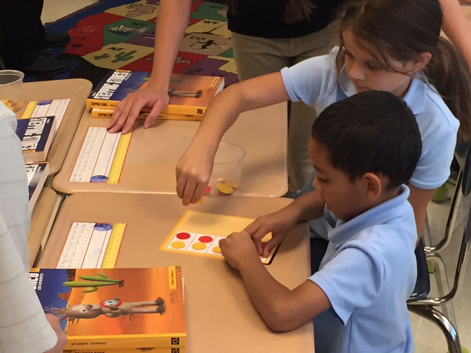 Kids use counters to add and subtract