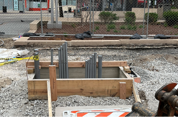 Inside the work zone at Fifth Avenue and Market Street where contractors placed a wood frame before a new concrete foundation is poured for a traffic control box Inside the work zone at Fifth Avenue and Market Street where contractors placed a wood frame before a new concrete foundation is poured for a traffic control box
