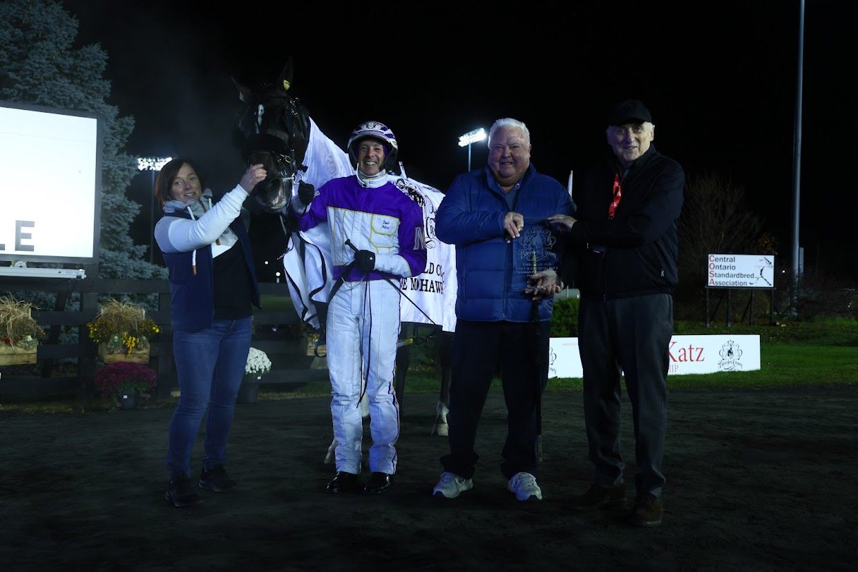 Ammo and connections celebrate Breeders Crown 2 year old colt pace final win 