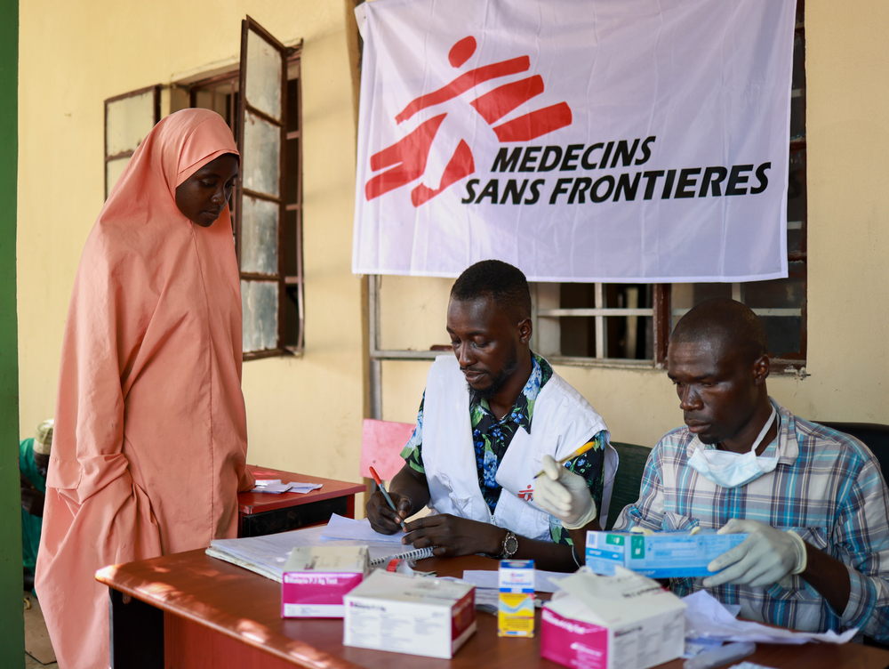 Zainab Mohammed, receiving a medical consultation at the MSF mobile clinic in the Yerwa camp. Luckily, she along with her husband and three children escaped when water flooded their house in Maiduguri, but she says that they are ill following the flood. She and her family now live in Yerwa camp, in Maiduguri and have to rely on aid. Photographer: Abba Adamu Musa | Location: Maiduguri | Date: 18/09/2024 Zainab Mohammed, receiving a medical consultation at the MSF mobile clinic in the Yerwa camp. Luckily, she along with her husband and three children escaped when water flooded their house in Maiduguri, but she says that they are ill following the flood. She and her family now live in Yerwa camp, in Maiduguri and have to rely on aid. Photographer: Abba Adamu Musa | Location: Maiduguri | Date: 18/09/2024
