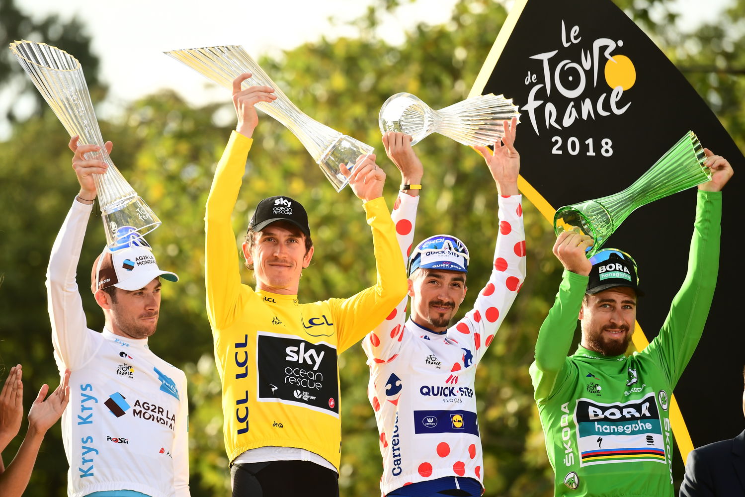 With 21 stages and a total of 3,351 km behind him,
Geraint Thomas (in the yellow jersey) celebrated as the
overall winner of arguably the toughest cycling race in the
world. From the left Pierre Latour, Geraint Thomas, Julian
Alaphilippe and Peter Sagan.