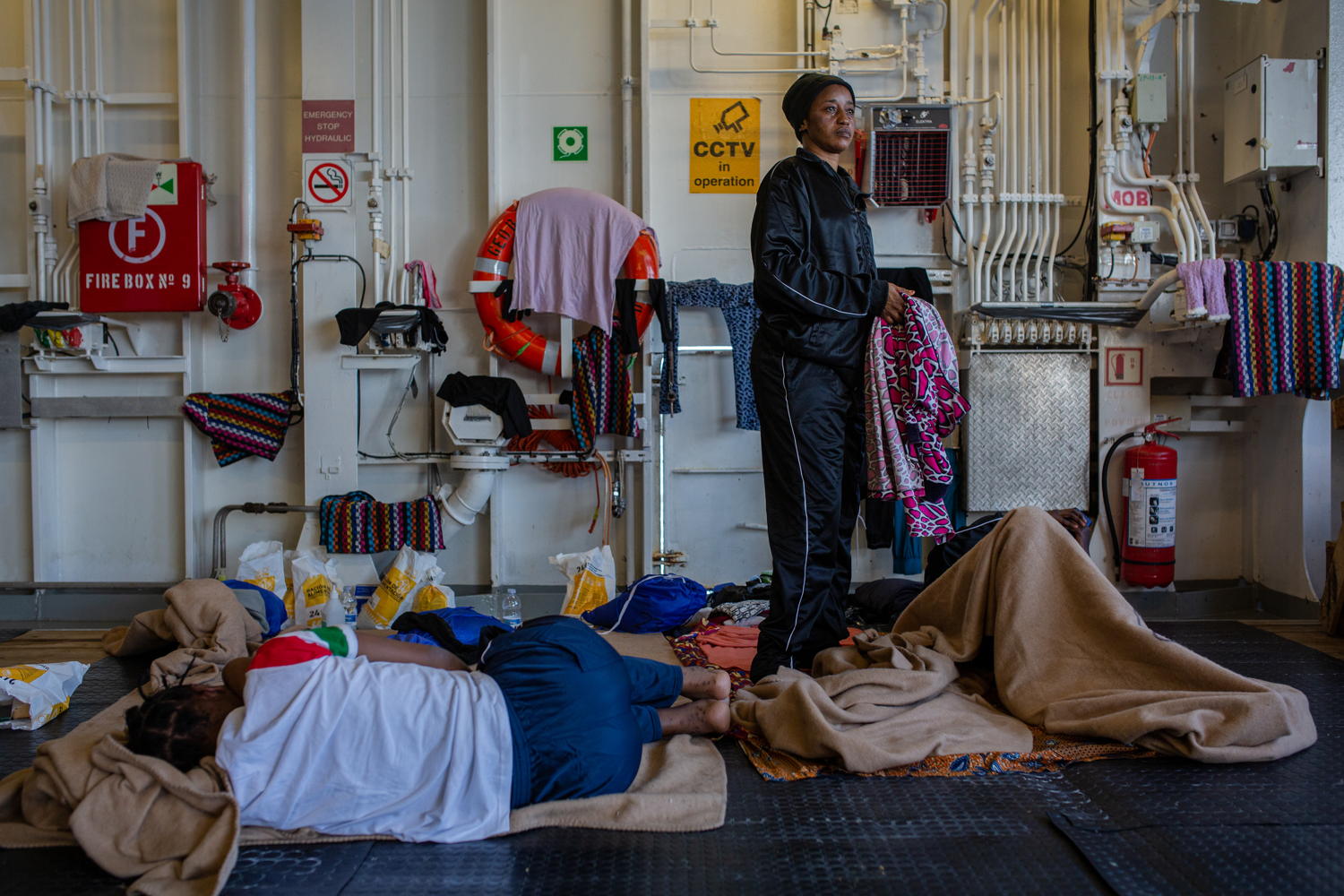 Rescued women rest on the ‘streamer deck’ (the deck for women and children). Photographer: Mahka Eslami. Date: 09/12/2023. Location: Mediterranean Sea