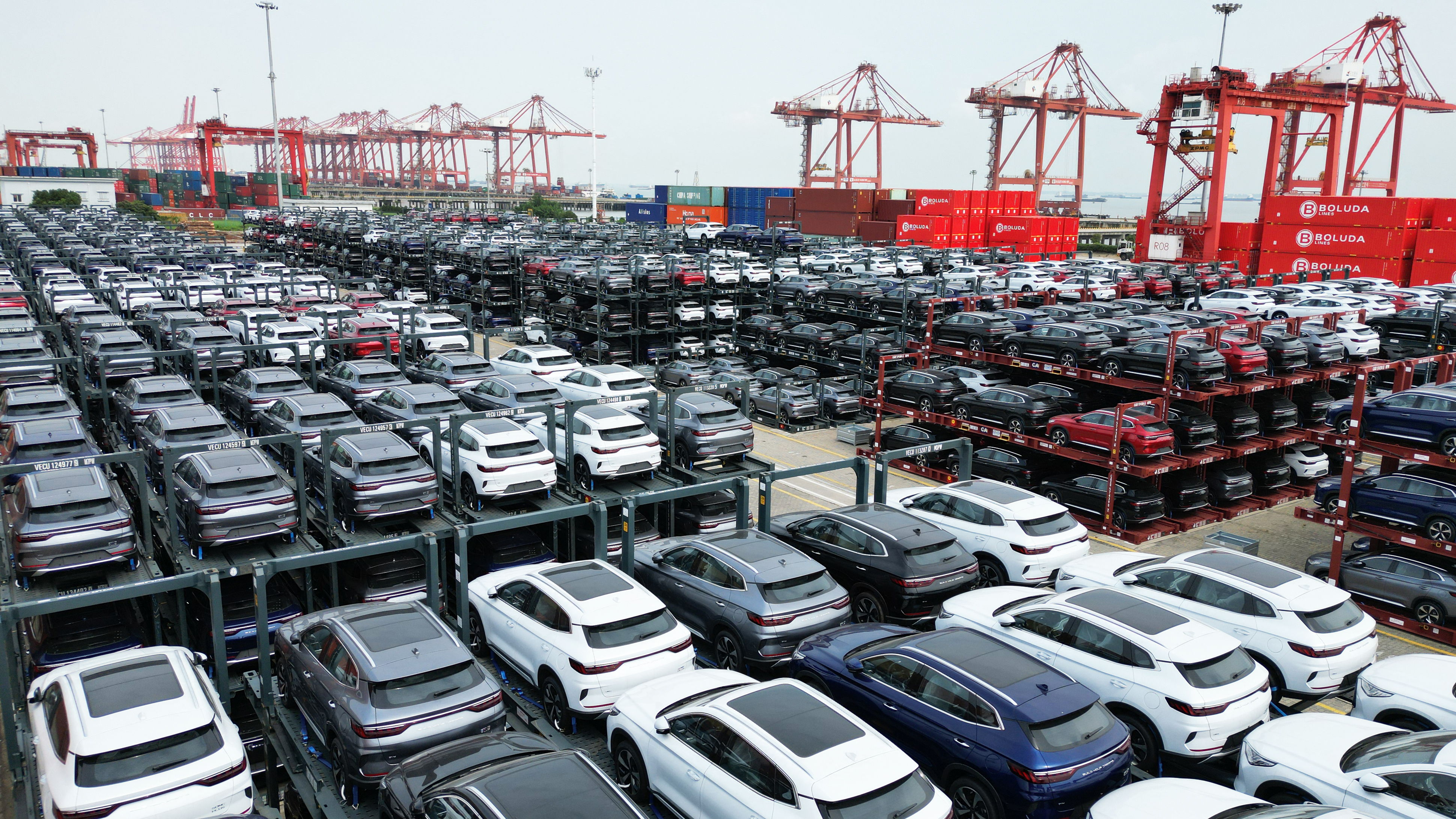 BYD electric cars wait to be loaded on a ship at Suzhou Port, in China’s Jiangsu Province © PHOTO AFP