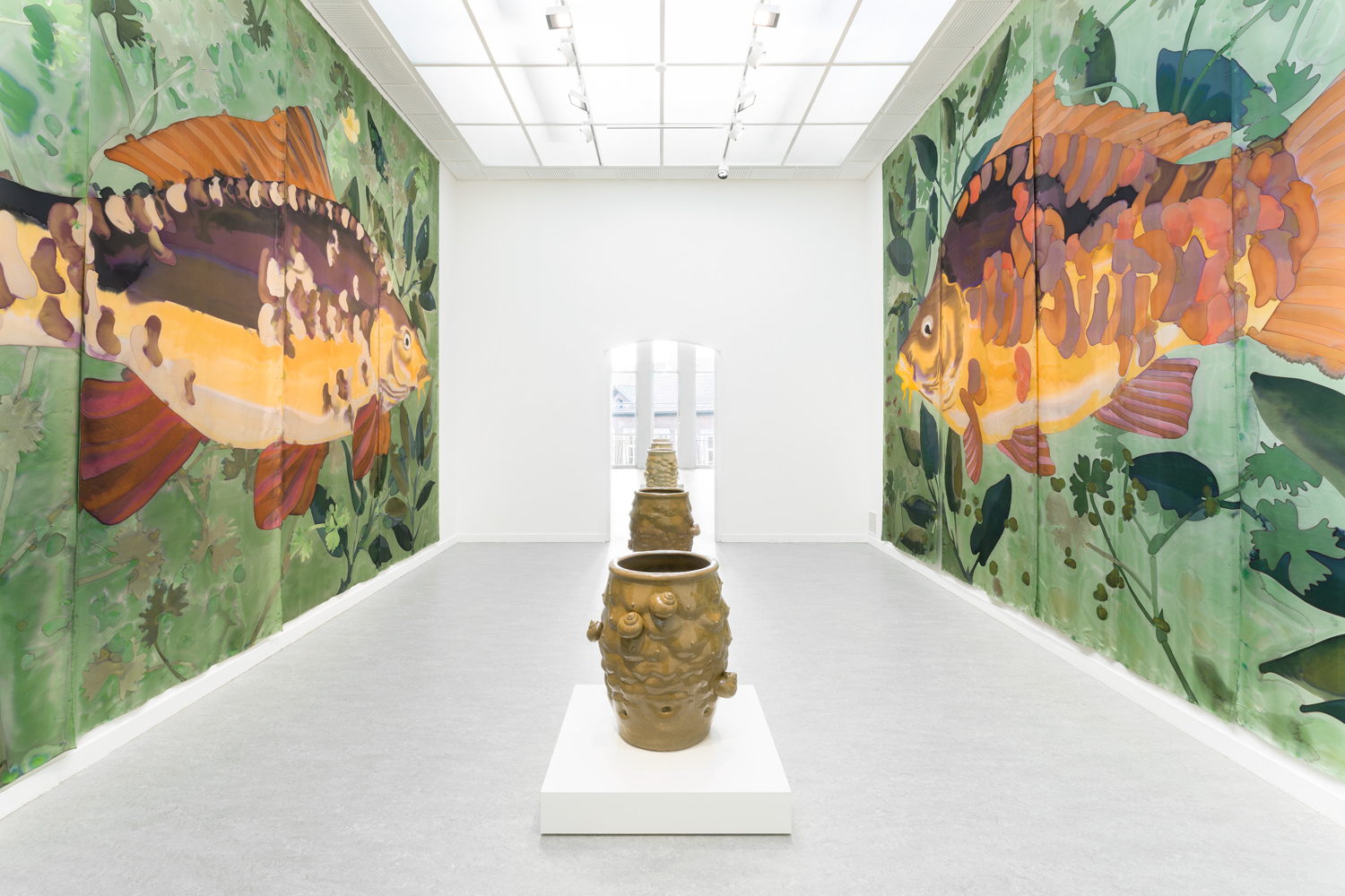 Daniel Dewar & Grégory Gicquel, Installation view The Wet Wing at Z33, Hasselt. Foreground: Stoneware jar with body fragments and snails, 2024. Background: Silk painting with mirror carp, common water-crowfoot, pondweed and duckweed, 2025. Commissioned by Z33. Courtesy the artists and Galerie Loevenbruck, Paris. Photo: Lola Pertsowsky