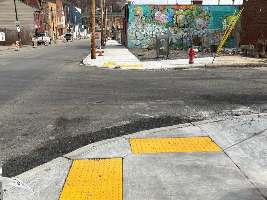New sidewalks, curbs and accessible ramps recently installed at Forbes Avenue and Jumonville Street