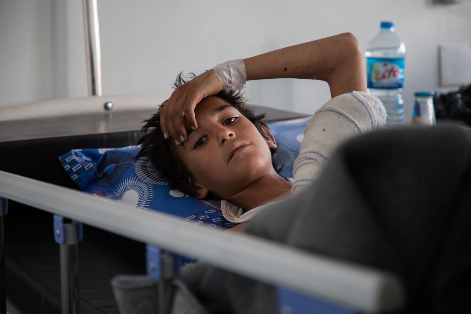On 9 March, Ali* (all names have been changed) and 4 of his brothers and cousins were taking care of the sheep in a farming land in Kubar, Deir ez-Zor, when a landmine or booby-trap exploded. They arrived in the MSF hospital in Hassakeh five hours later, brought in by their relatives. One of the boys, Nabil*, 5 years old, was already dead. Ali* (12) was suffering from a critical abdominal injury and needed an urgent laparotomy. His brother, Khaled* (10), had a severe head trauma, with a fractured skull. Marwan* (8) and Redhwan* (13) had minor shrapnel wounds. 

“It sounded like an airstrike, explains Leila*, their aunt. It was very strong, we all heard it. Many of us rushed to see what happened. I could not believe it. One of the boys had part of the brain out. They were just playing with marbles. One of the kids did not survive the explosion. We have heard of 10 similar incidents lately. Some of the people have been killed on the spot. We need expert organizations to come remove the mines. It’s already March, spring… We are afraid of more explosions, but we really have to move our sheep to graze in the fields.” 

All the surviving boys were discharged from the hospital after one week, except for Khaled, who got neurosurgery in a more specialized health facility and could also go home.
Taken 13 March 2018, credit MSF/Louise Annaud