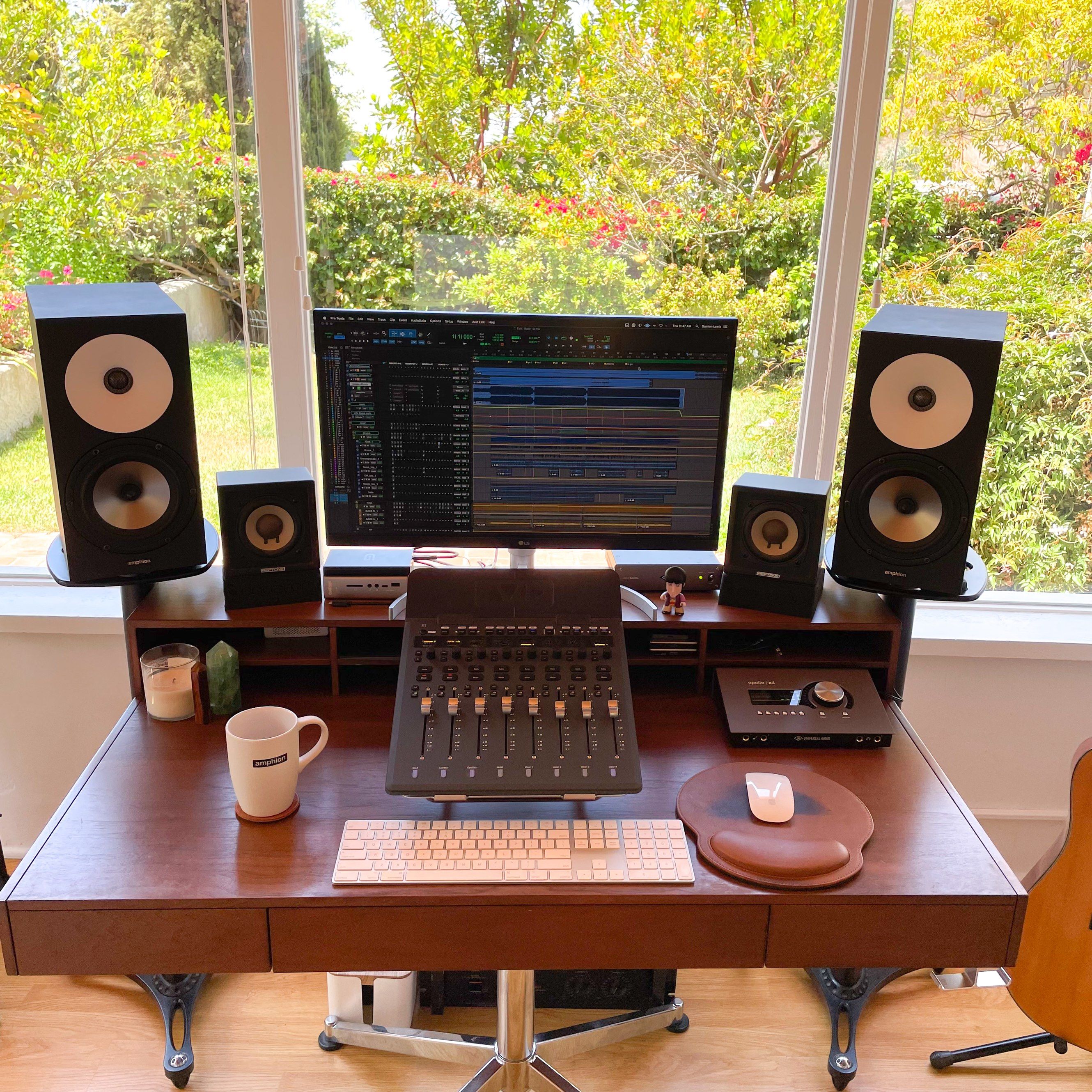 Lewis’s home setup consists of a MacMini with an Avid S1 Control Surface, Apollo interfaces, and a variety of favored plugins in addition to his Amphion One18s and Amp700.