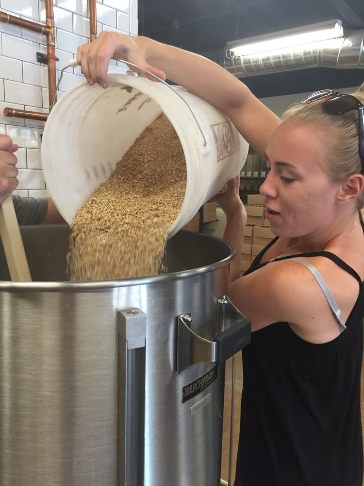 Grain is added to the mash during the brewing process