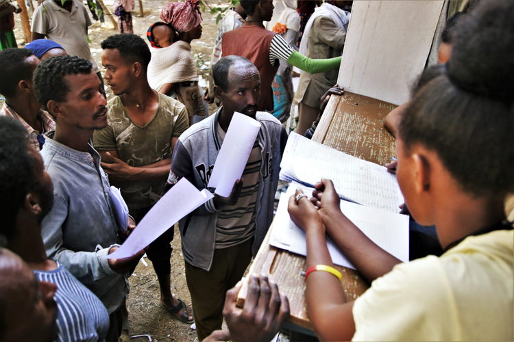 Administrators register newly arrived displaced people at Tsegay Berhe school, in the city of Adwa in central Tigray, northern Ethiopia. Photographer: Igor G. Barbero / MSF Administrators register newly arrived displaced people at Tsegay Berhe school, in the city of Adwa in central Tigray, northern Ethiopia. Photographer: Igor G. Barbero / MSF