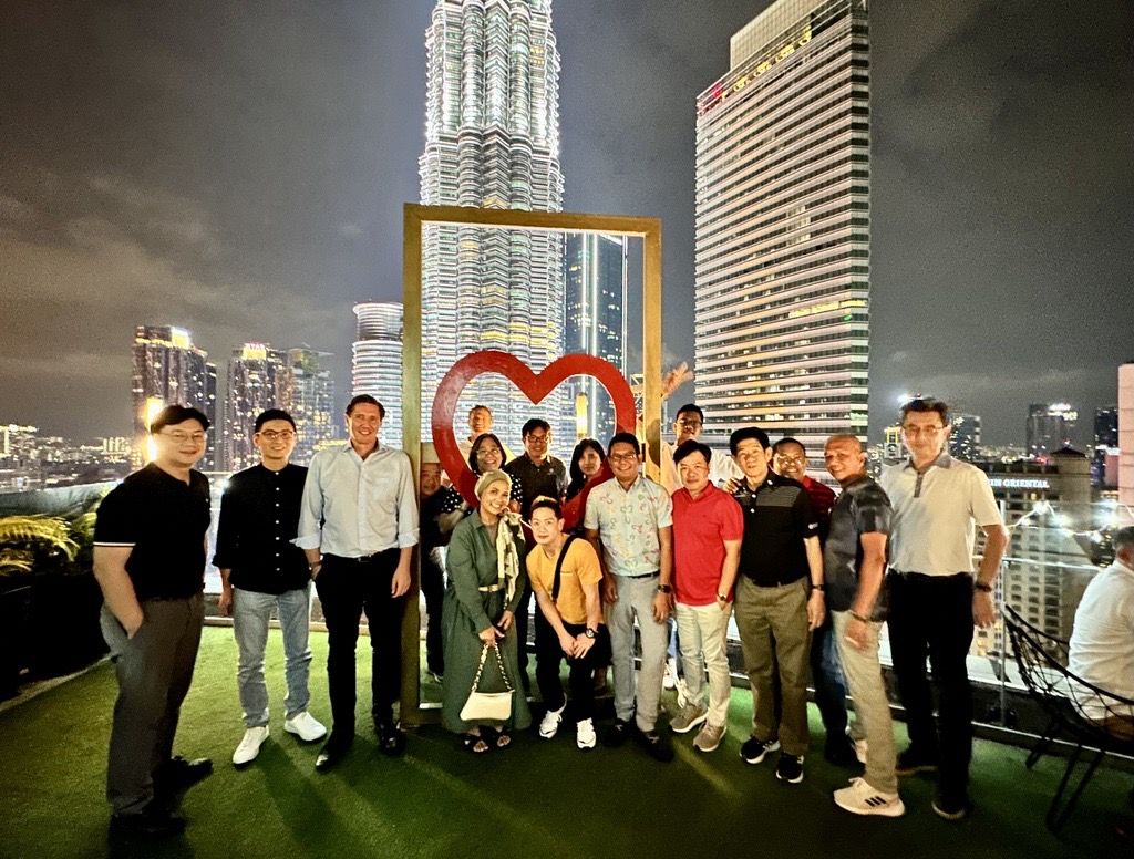 Capturing the moment in the shadow of greatness - Our team at the iconic Petronas Twin Towers