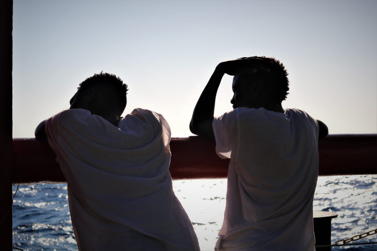 Rescued people on board Ocean Viking waiting on deck.
Copyright: Hannah Wallace Bowman/MSF