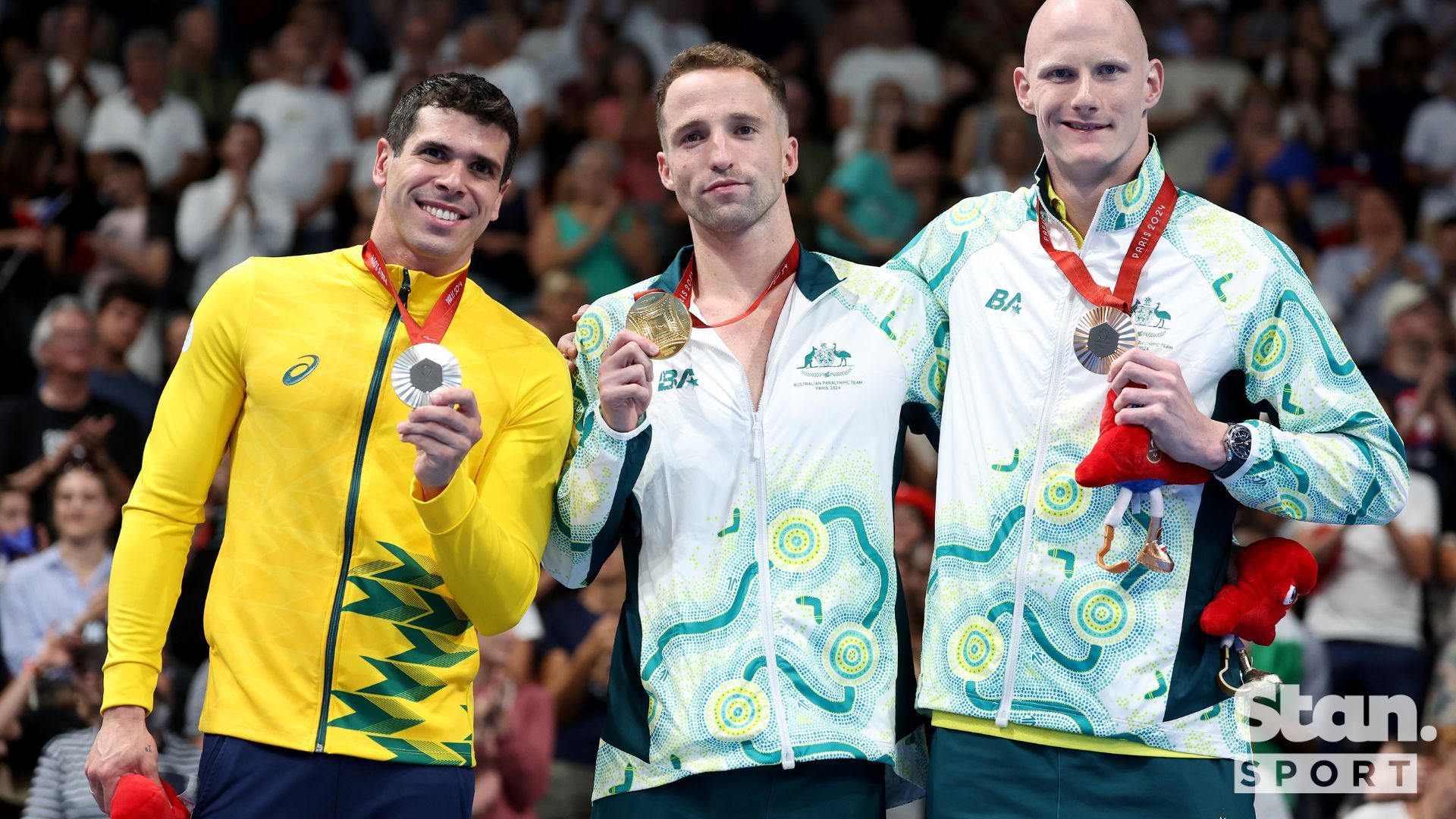 Thomas Gallagher (centre) and Rowan Crothers (right) share the podium.