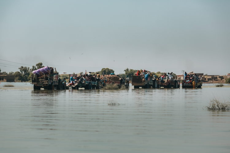 Recorded: 06 October, 2022 Caption / Description: People using tractor trollies as a means of transportation as roads start to reappear as flood waters drop, Dadu district, Sindh (c) Asim Hafeez Recorded: 06 October, 2022 Caption / Description: People using tractor trollies as a means of transportation as roads start to reappear as flood waters drop, Dadu district, Sindh (c) Asim Hafeez