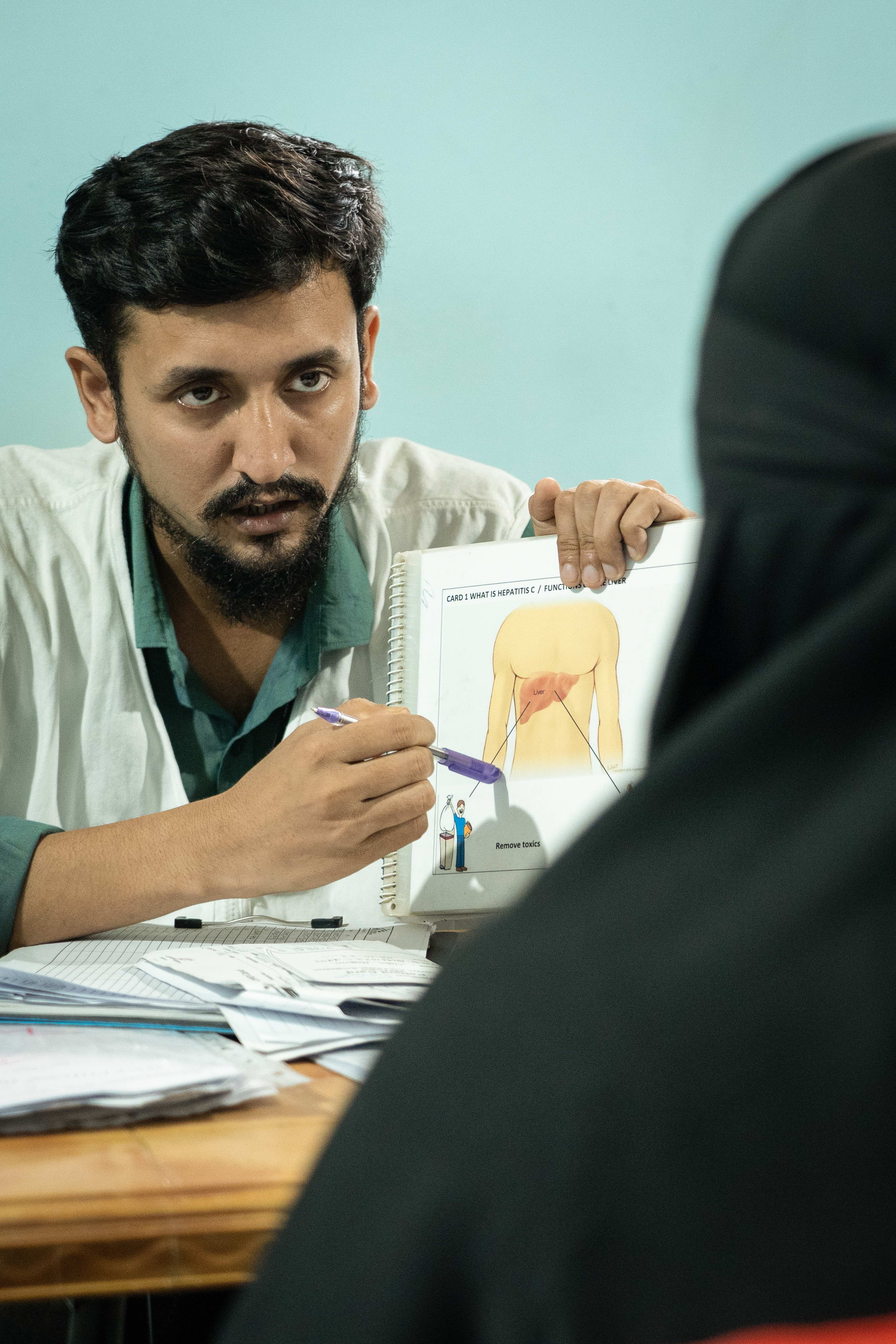 Taraqul Islam is a counsellor educator working at MSF’s Jamtoli clinic at the Rohingya refugee camp in Ukhiya, Cox’sbazar, Bangladesh. He provides counselling to patients suffering from Hep C; also provides information about Hep C. | Date taken: 26/05/2024 | Photographer: Abir Abdullah Taraqul Islam is a counsellor educator working at MSF’s Jamtoli clinic at the Rohingya refugee camp in Ukhiya, Cox’sbazar, Bangladesh. He provides counselling to patients suffering from Hep C; also provides information about Hep C. | Date taken: 26/05/2024 | Photographer: Abir Abdullah