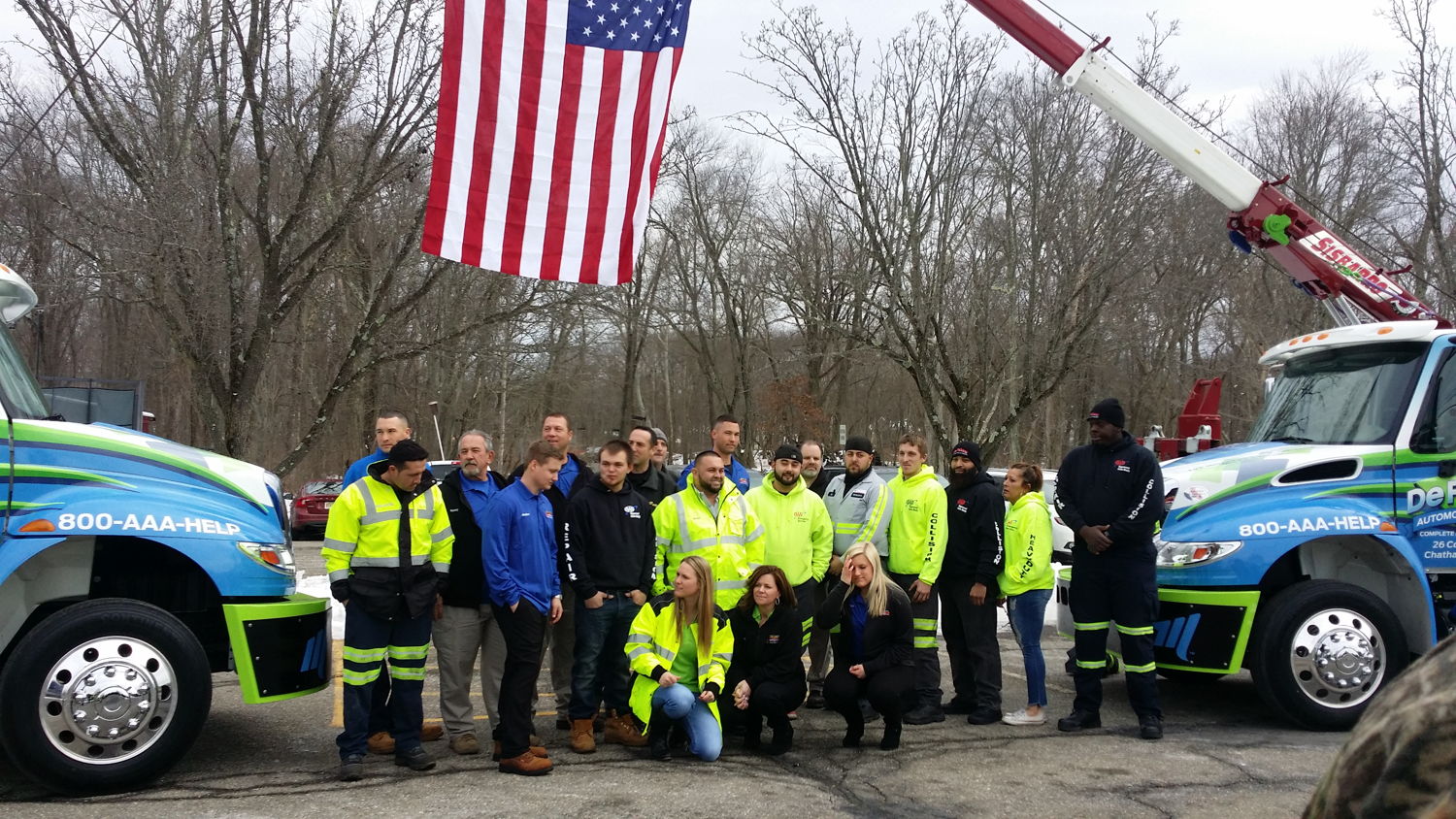 The Rempfer family and friends in front of the tow truck with Lung Cancer Foundation of America signage
