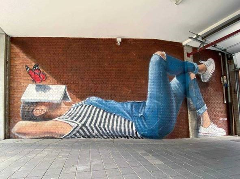Stad Leuven fleurt ingang Tweebronnen op met reusachtige street art muurschildering