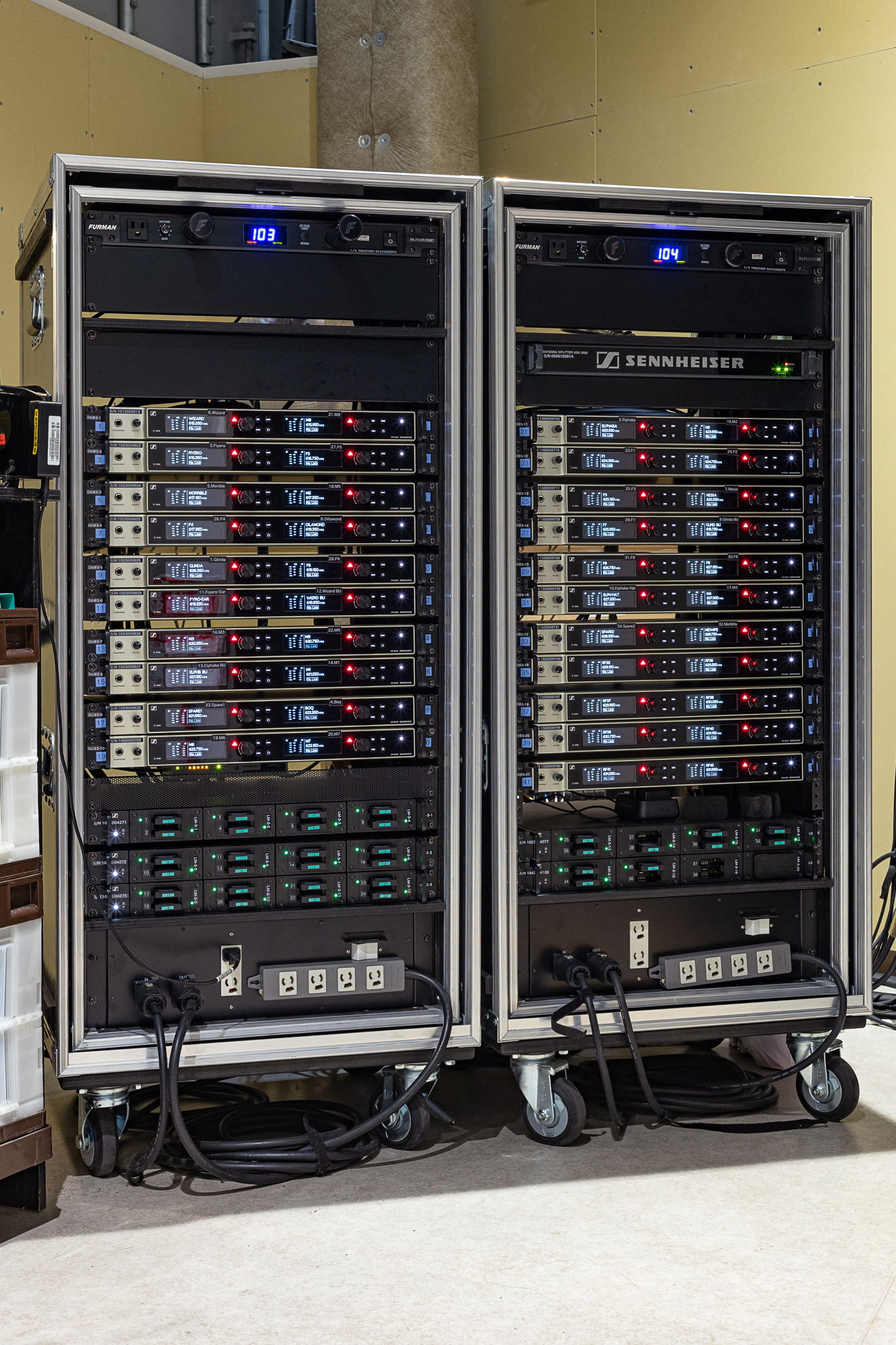 The racks contain 21 EM 6000 Dante receivers as well as a L 6000 chargers for the mini bodypack transmitters