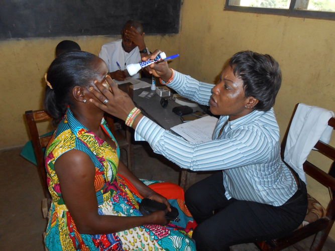 A villager from the rural Jaman North District is examined by an optometrist at the Sampa District Hospital. Changing Lives Together provided eye glasses for this poor rural district. The typical family earns $1 to $2 per day to feed 6-8 people. Unemployment estimates for the district are 70-80 percent.