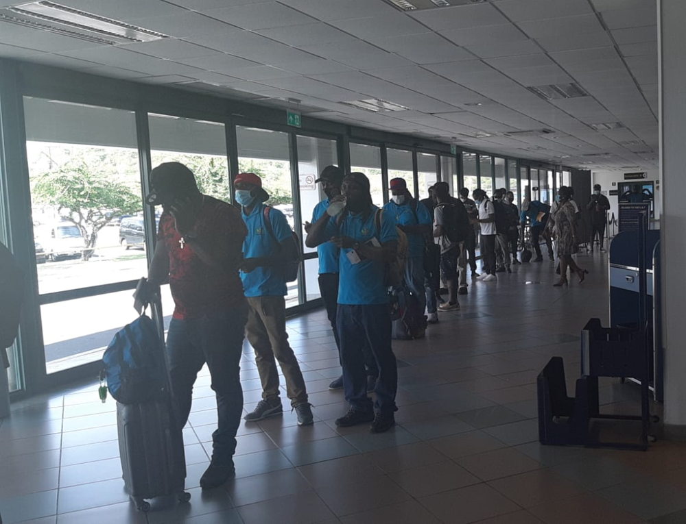 Farm workers from the OECS prepare for departure to Canada.