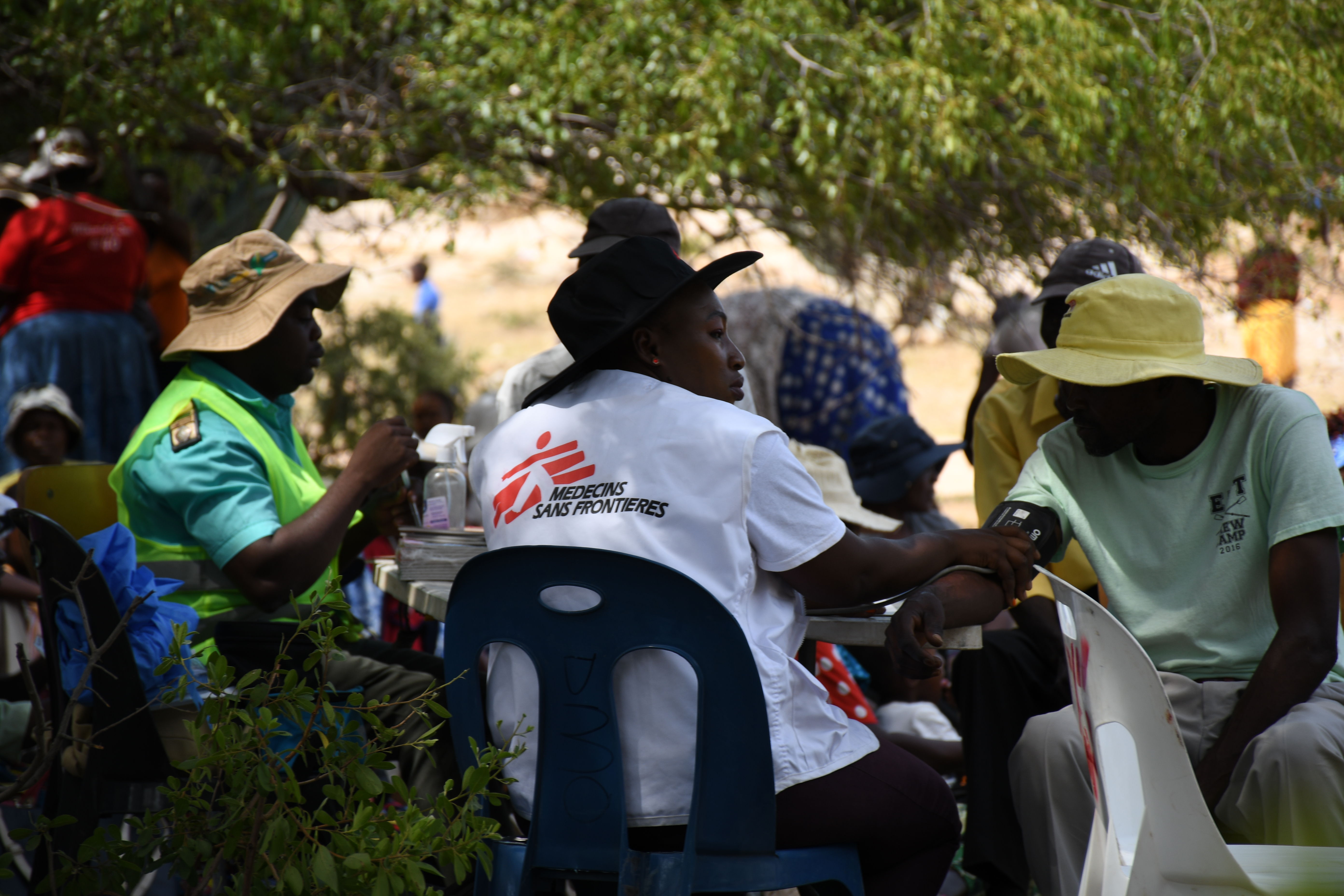 MSF staff assisting patient. MSF| Location: Zimbabwe