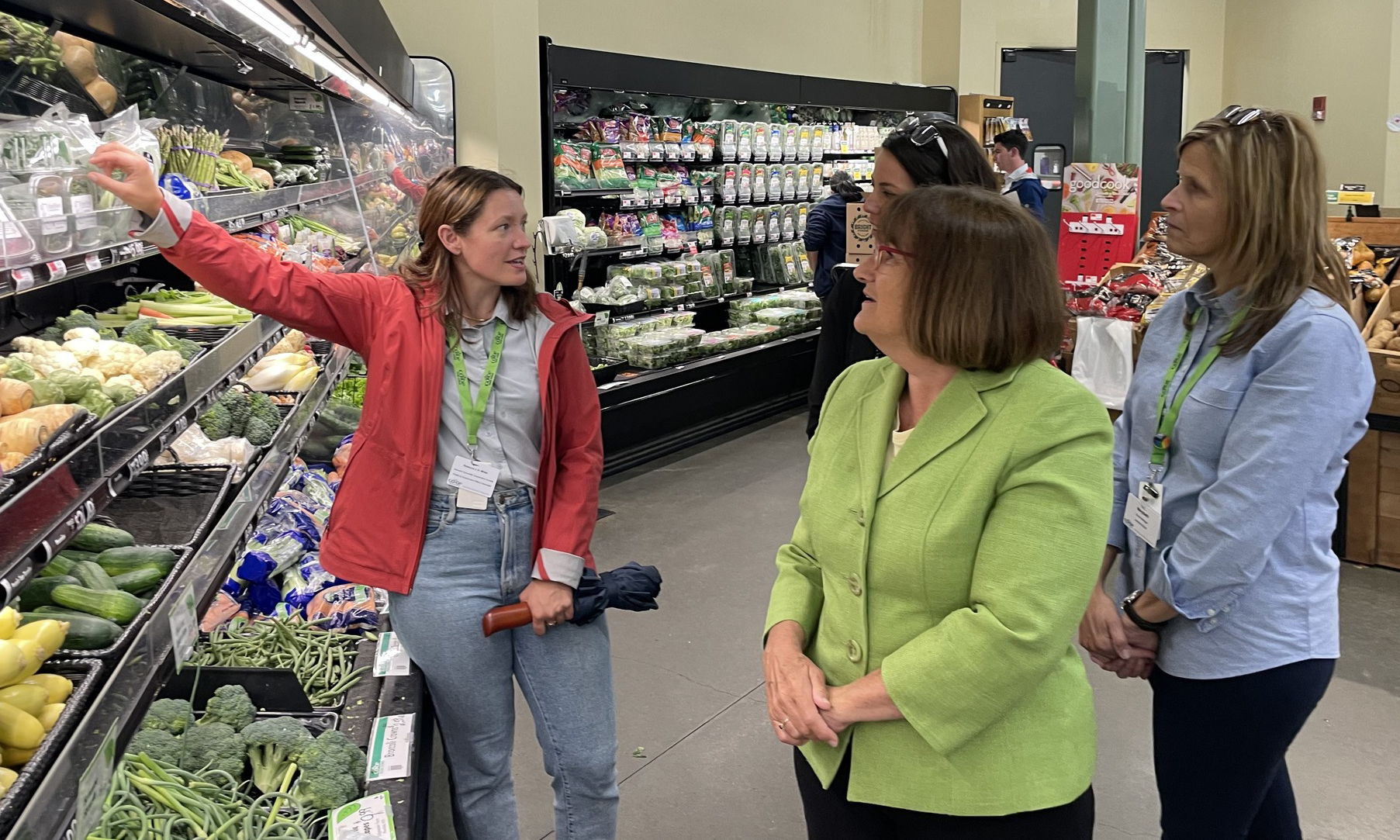 Rebecca J. H. White (left) of the Hanover Co-op touts the critical importance small producers such as Omnipotent Greens of Lebanon, NH have in building local food security. Omnipotent Greens provides micro-greens to Hanover Co-op shoppers and is a vendor at area farmers markets. (Also shown, Rep. Kuster, center; Co-op GM Amanda Charland, back; Lebanon store manager, Marybeth Fenton, right.) https://omnipotenthorticulture.com/