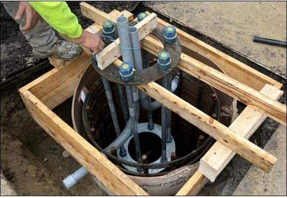 A traffic signal foundation being installed at Sixth and Centre