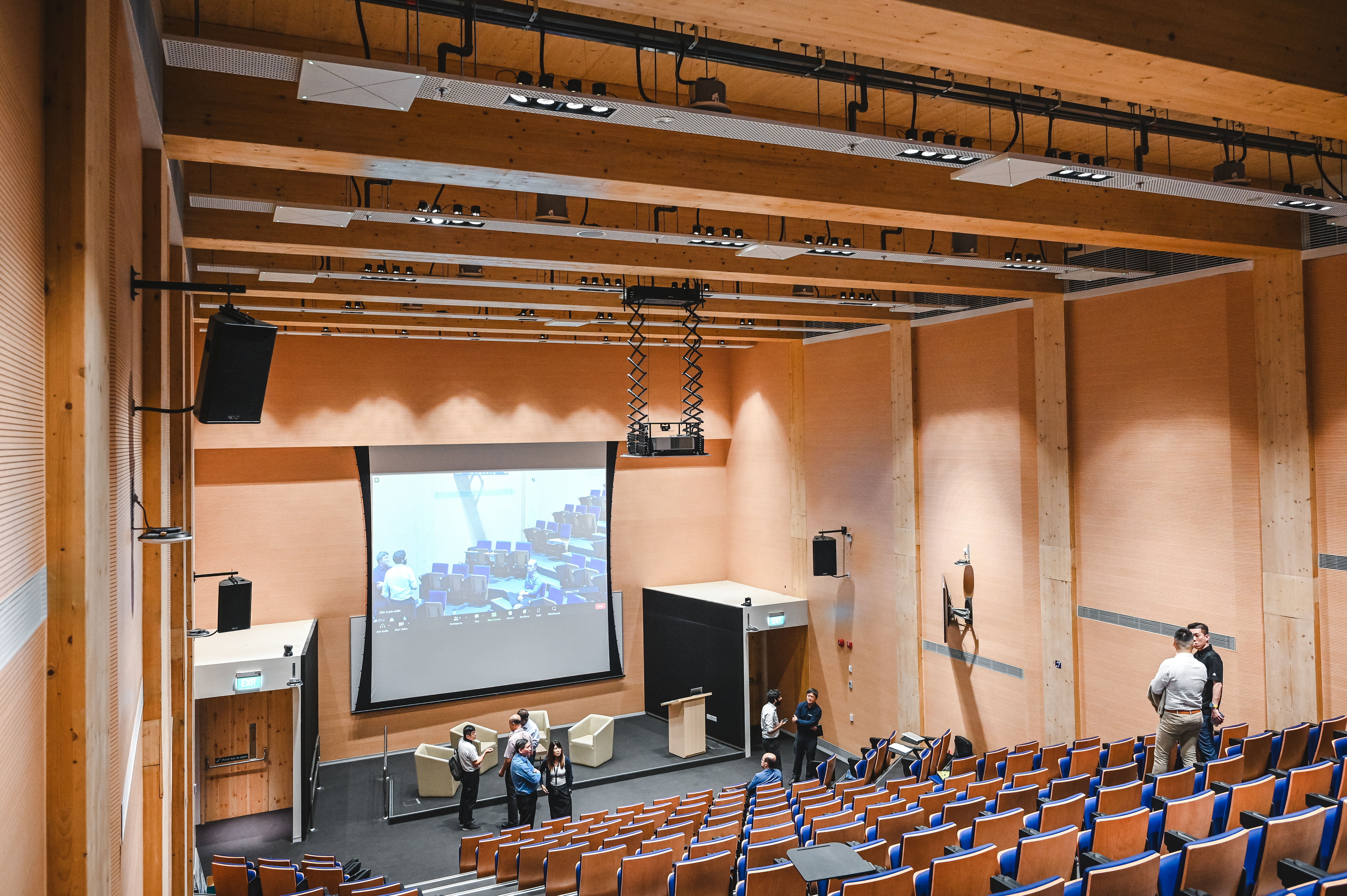 The auditorium is characterized by a 9-meter ceiling height at the front with varying height running throughout the rest of the room due to the cascading theatre seating arrangement