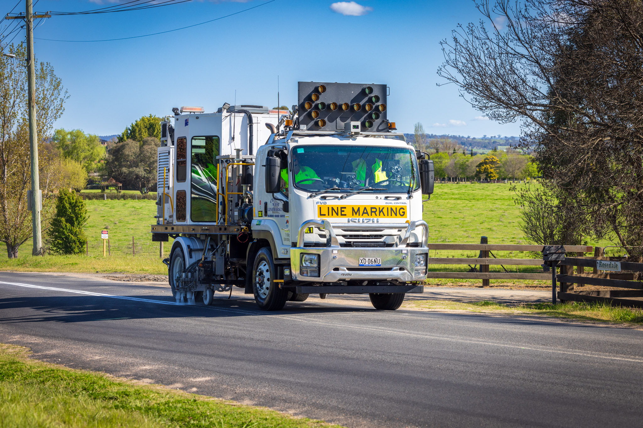 An Isuzu FVD Dual Control is mounted with a purpose-built operator cab from Core Equipment in Canada, allowing for precise road marking