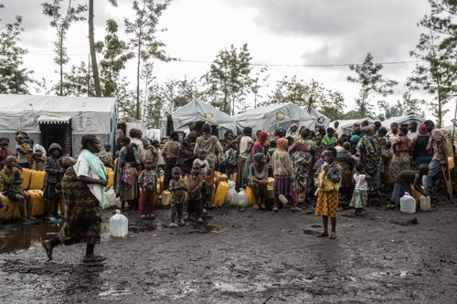 Displaced people are waiting to collect water in Rusayo camp. Around 100,000 people live in this camp, hailing from different war-torn areas of North Kivu. Lack of clean water in the displacement sites remains a major obstacle for many individuals, which causes serious health risks. Copyright - Michel Lunanga/MSF