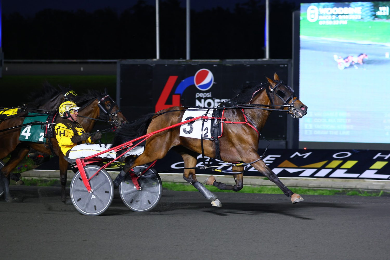 Valuable Miss and Trevor Henry winning a division of the Champlain. (New Image Media)