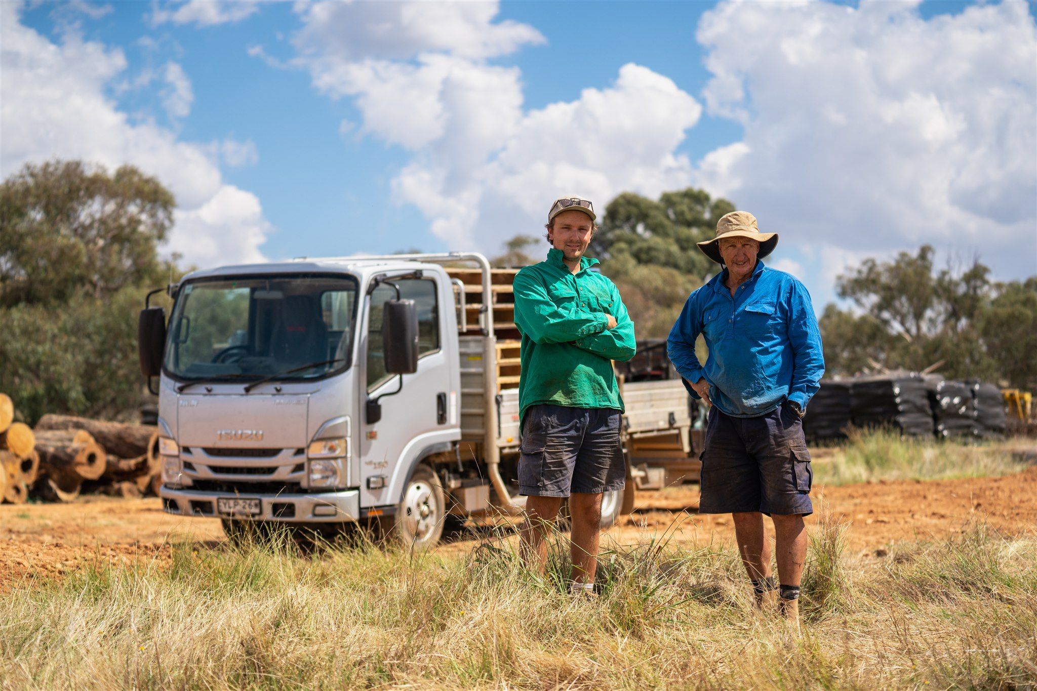 From left to right: Xavier Phyland and Paul Phyland with their Isuzu NLR 45-150 Traypack