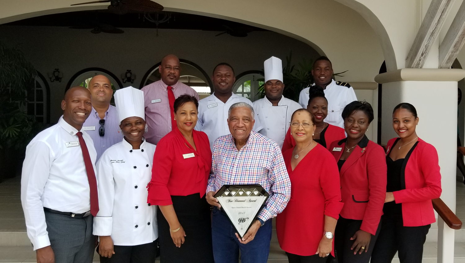 Sir Royston Hopkin and Staff at the Spice Island Beach Resort, Grenada.