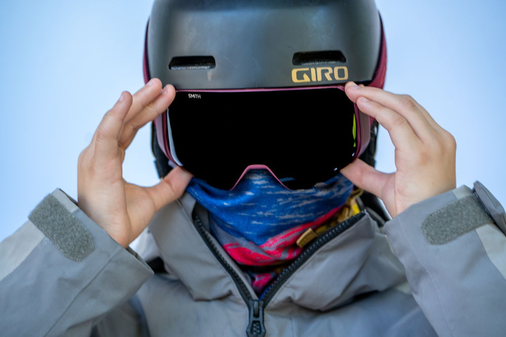 For an extra arctic day, a gaiter and goggles protect the entirety of a skier's face.