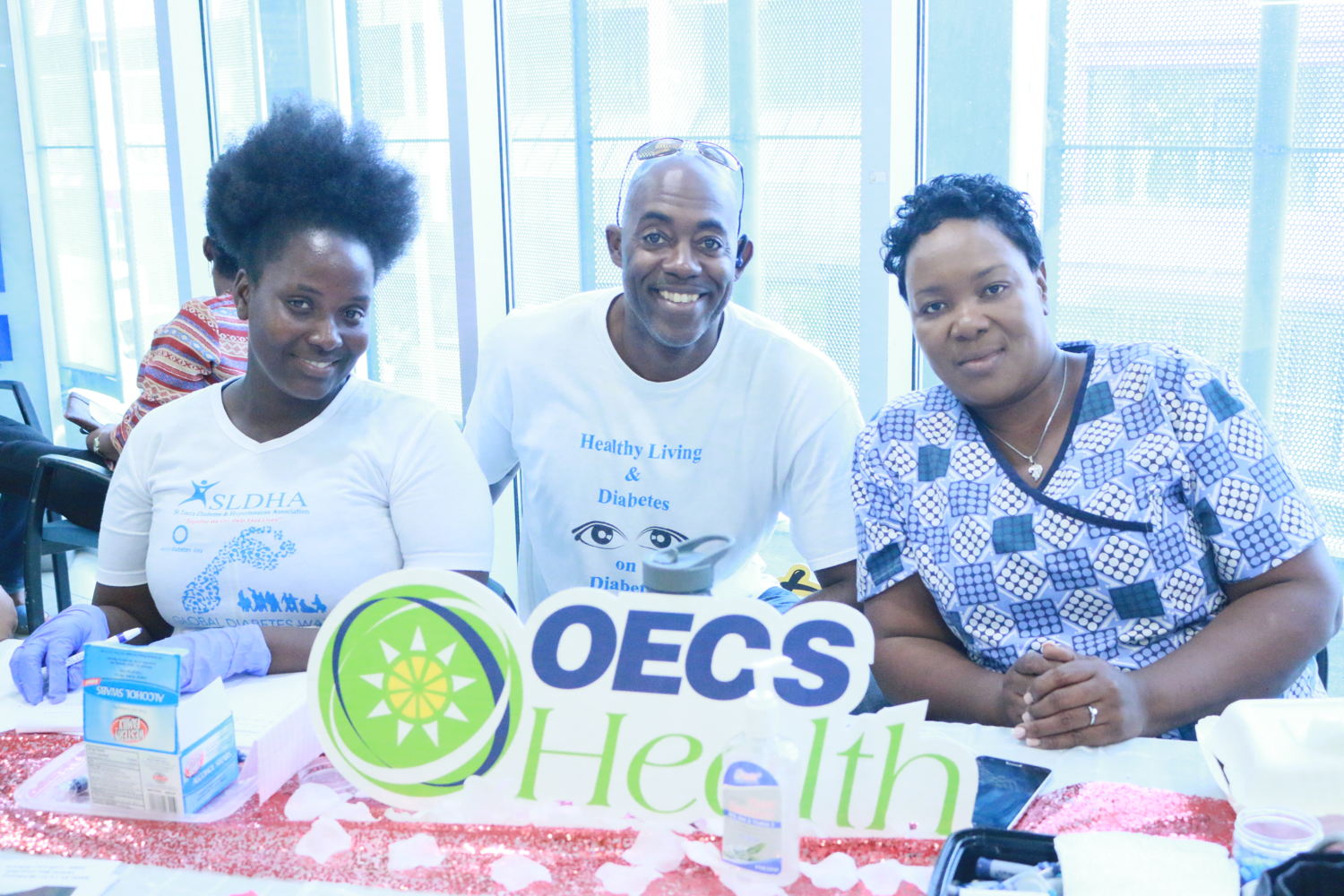 President of the Saint Lucia Diabetes and Hypertension Association Andrew Felix with two health professionals at the 'Love Your Feet Campaign, Blue Coral mall'.