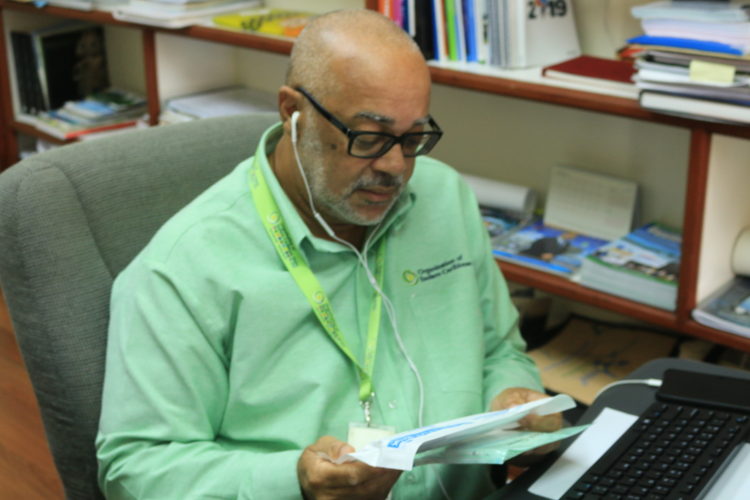 OECS Director General Dr. Didacus Jules examines the PPEs.